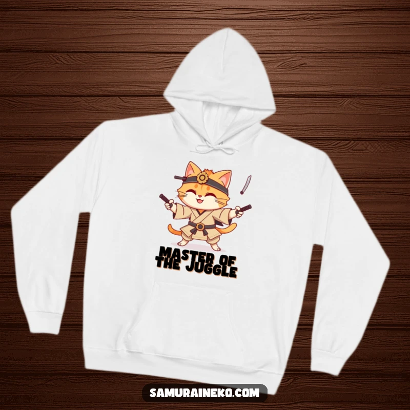 Funny cat samurai hoodie with a smiling cat character demonstrating impressive juggling skills with miniature katanas, radiating fun energy.