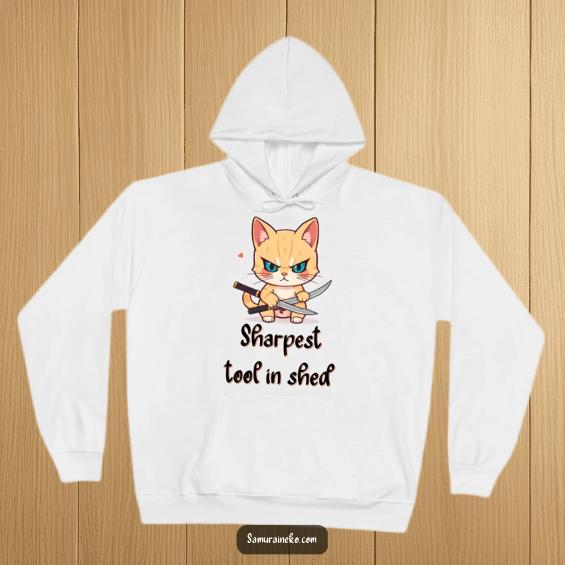 Funny hoodie showcasing a determined cat drawing a small katana, radiating focus, readiness, and a hint of playful danger.