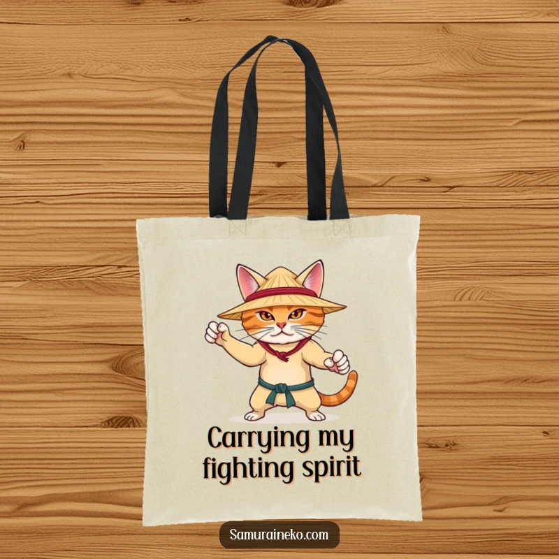 Funny tote bag with a determined cat in a martial arts pose, wearing a straw hat, ready for any task with feline focus.