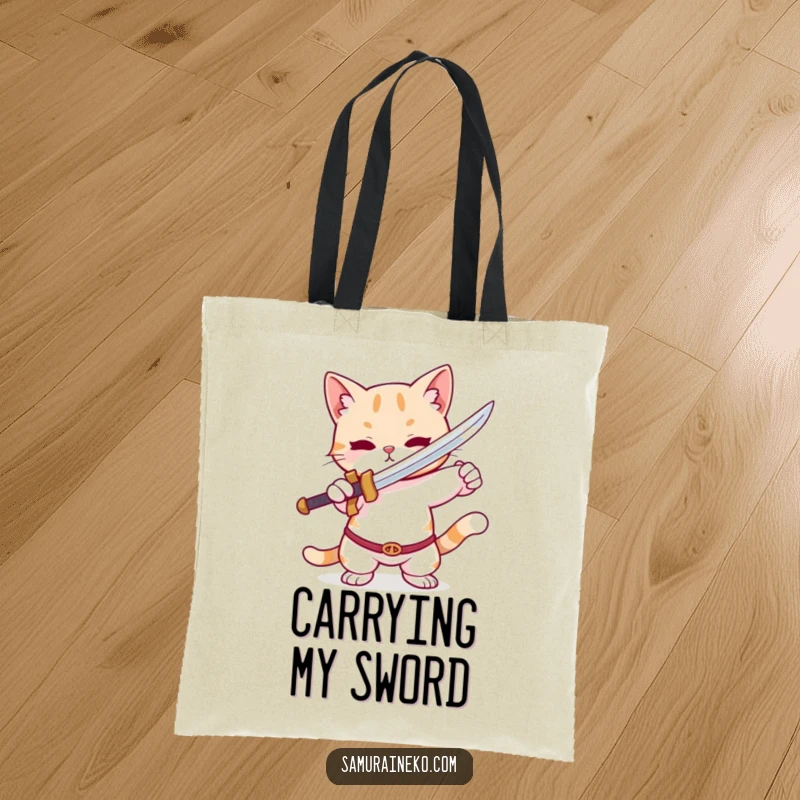 Funny Cat Tote Bag: A durable tote featuring a cute cat striking a playful pose with a tiny sword, great for everyday use.
